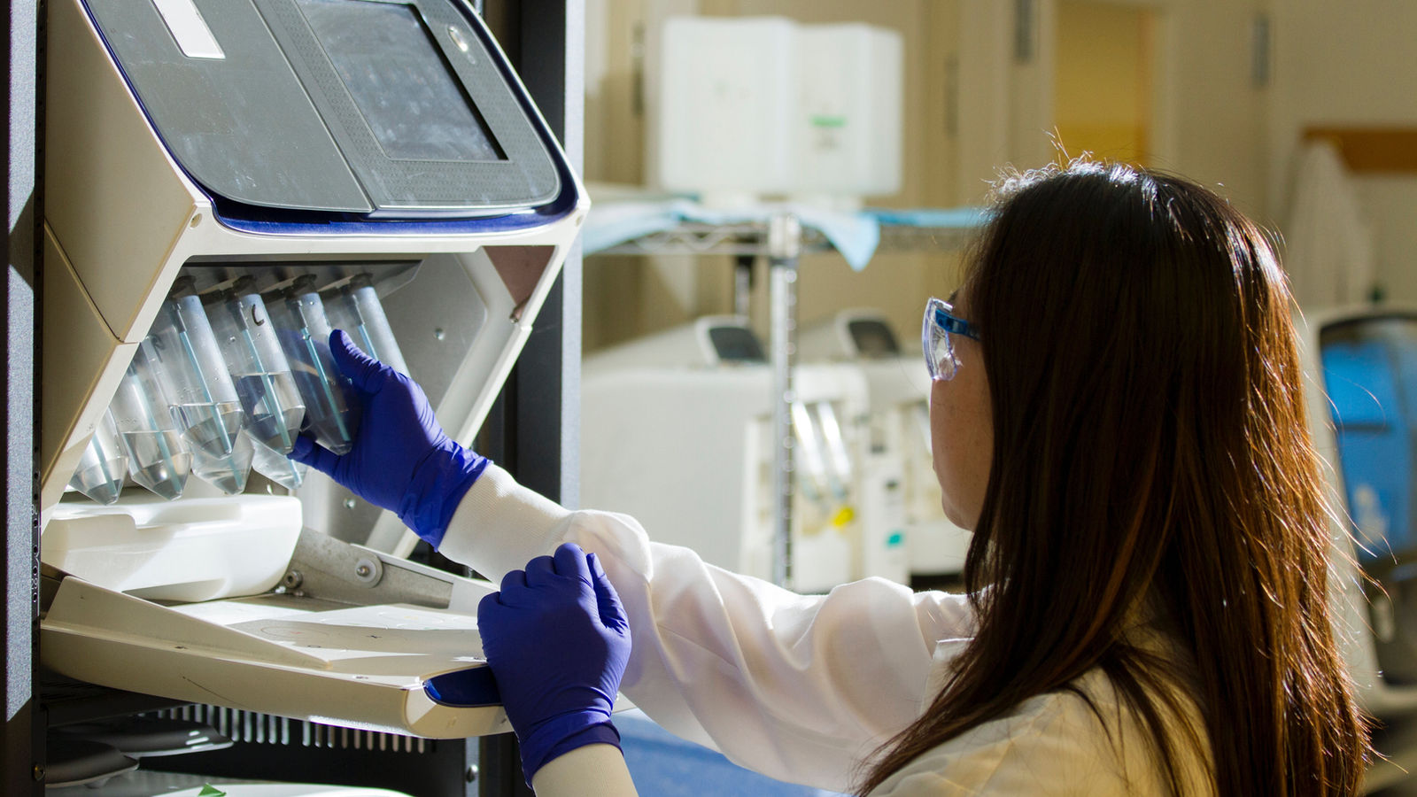 Researcher working with laboratory equipment